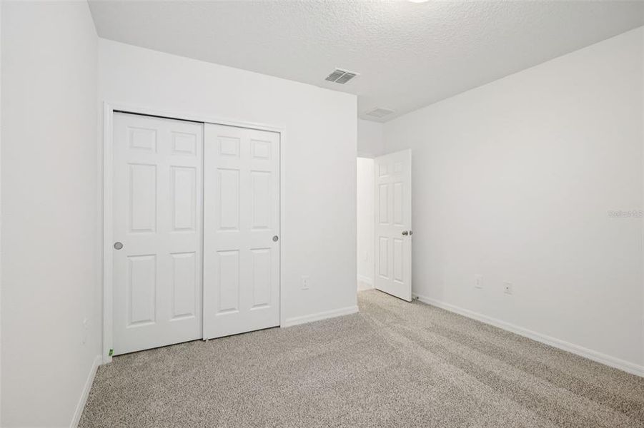 Spacious, unfurnished interior of a new home in Villamar - Signature Series, Winter Haven (Image 22).