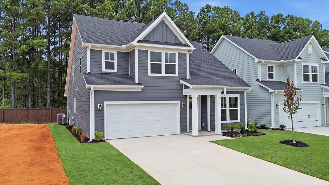 Front exterior of a new home in Barton Hollow Single Family Homes, Fountain Inn, SC, highlighting curb appeal (Image 2). Front exterior of a new home in Barton Hollow Single Family Homes, Fountain Inn, SC, highlighting curb appeal (Image 2).