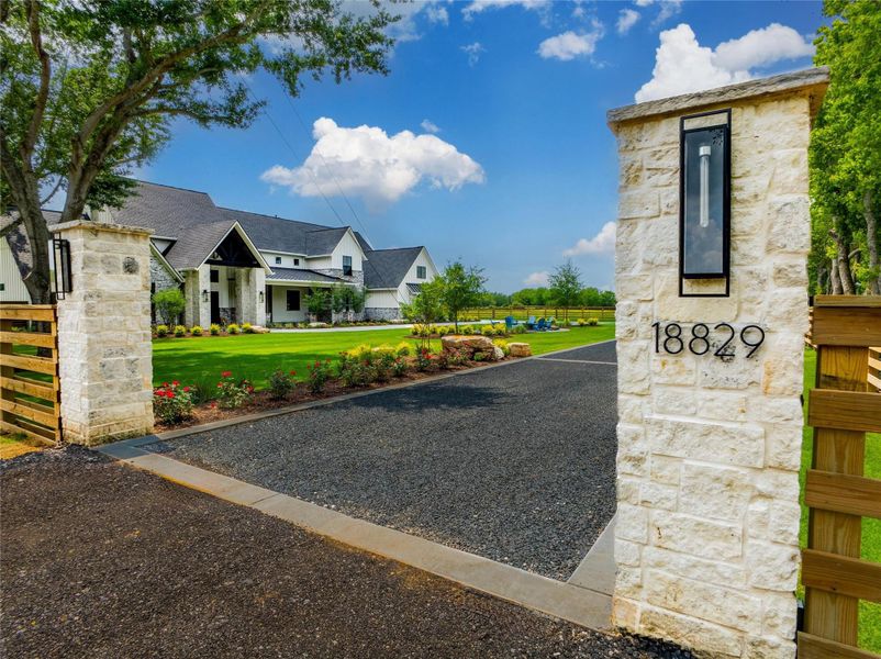 Dramatically welcome guests into your home with style. Fully lit columns and driveway add a beautiful touch as guests drive around the front entrance with a complete view of this carefully crafted and tastefully designed exterior and landscape. Dramatically welcome guests into your home with style. Fully lit columns and driveway add a beautiful touch as guests drive around the front entrance with a complete view of this carefully crafted and tastefully designed exterior and landscape.