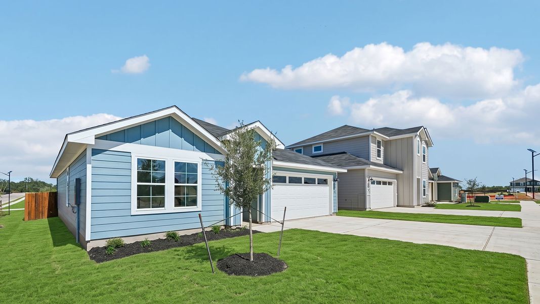 Front exterior of a new home in Watermill, Uhland, TX, highlighting curb appeal (Image 2).