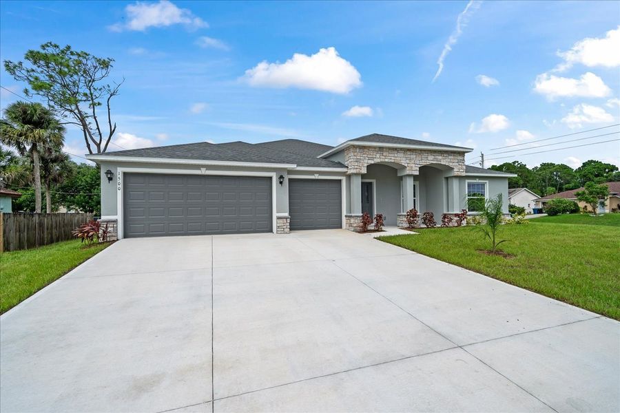 Representative exterior photo of a completed home built from the The Newport by Avtec Homes in Palm Bay & South Brevard, Palm Bay, FL (Image 1).