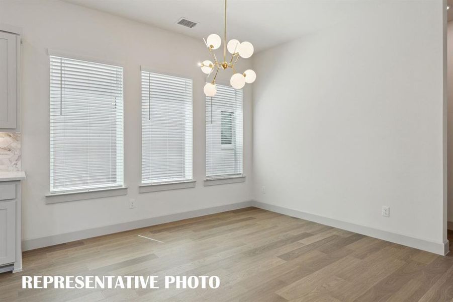 Whether it's lively dinner parties or cozy family meals, this light filled dining room fits all occasions!  REPRESENTATIVE PHOTO