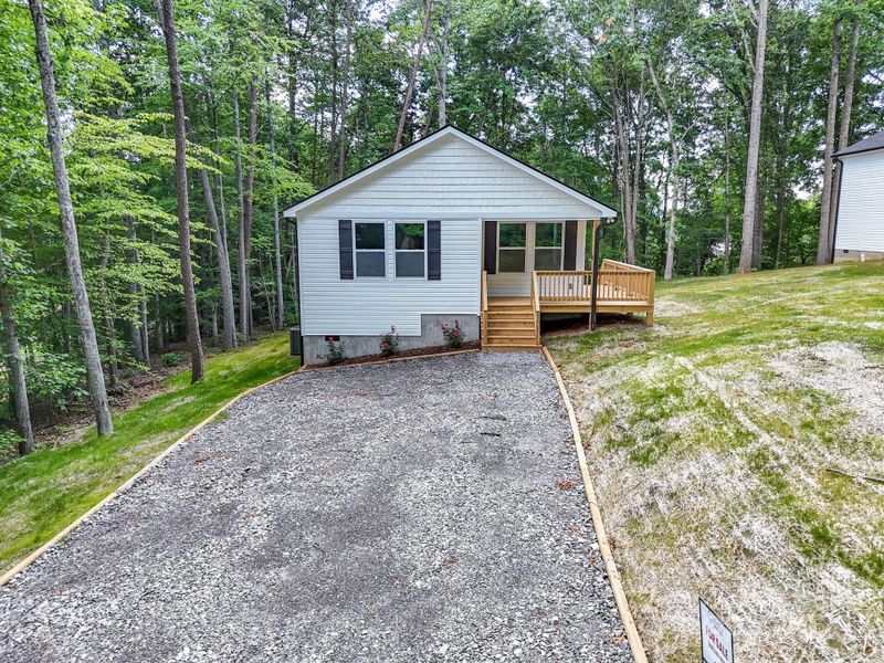 Front exterior of a new home in , Candler, NC, highlighting curb appeal (Image 26).