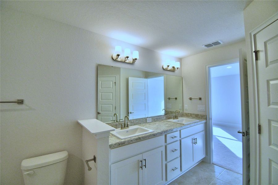 Furnished interior view inside a new home in Cadence Crossing, Auburndale (Image 12).