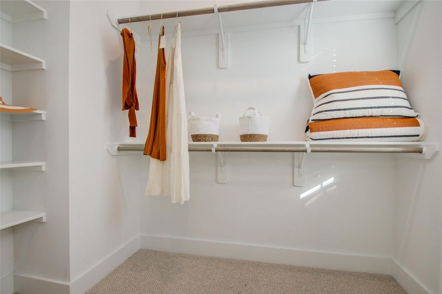 Large walk-in closet in the primary bedroom! Photos from another community by the same builder, FINISHES & FLOOR PLAN WILL VARY! Ceiling fans are not included!