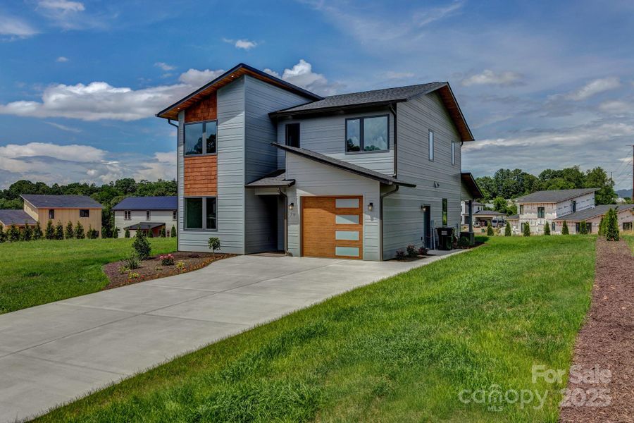 Front exterior of a new home in , Asheville, NC, highlighting curb appeal (Image 26). Front exterior of a new home in , Asheville, NC, highlighting curb appeal (Image 26).