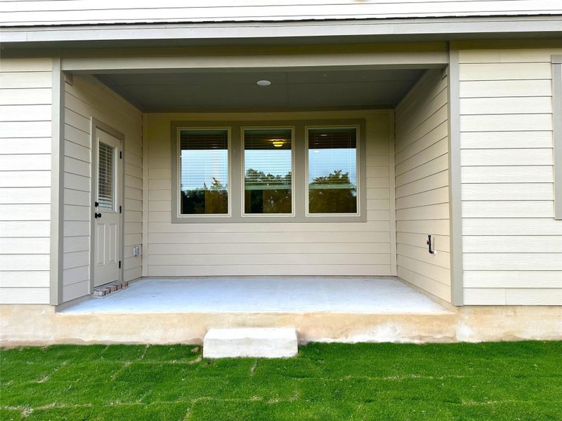 View of exterior entry featuring a patio