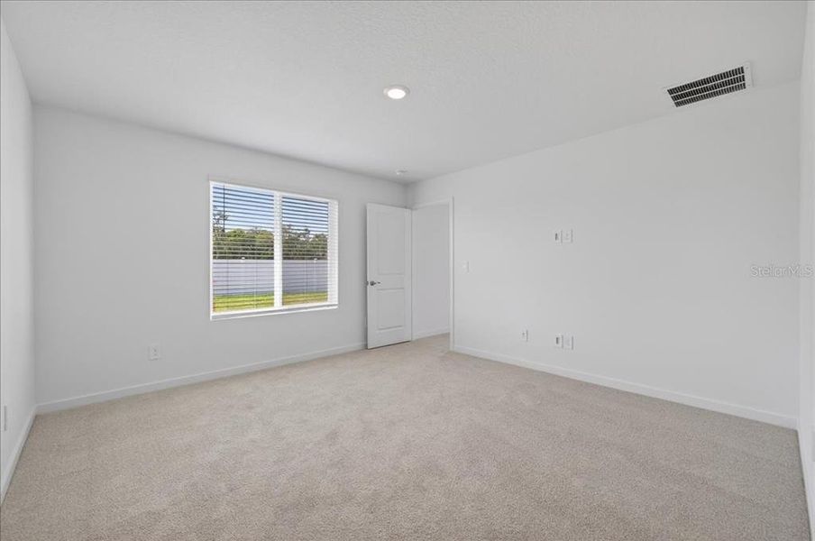 Spacious, unfurnished interior of a new home in Colbert Landings, Palm Coast (Image 22).