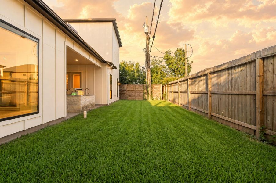 Your backyard offers a private stretch of green space, creating the perfect setting for relaxing evenings and effortless outdoor entertaining.