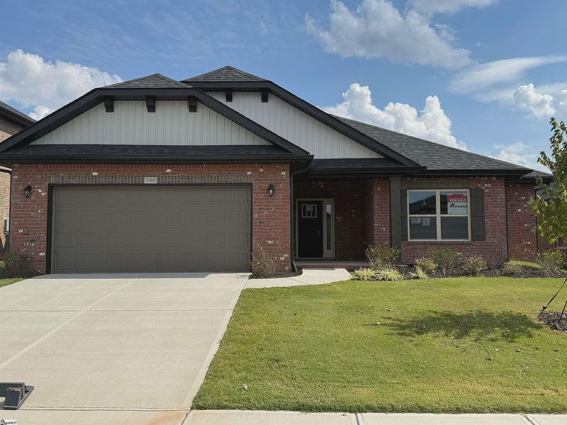 Front exterior of a new home in Bracken Woods, Piedmont, SC, highlighting curb appeal (Image 1).