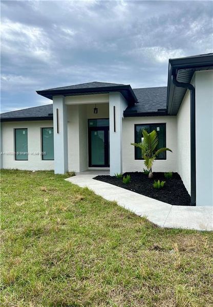Front exterior of a new home in , Lehigh Acres, FL, highlighting curb appeal (Image 1). Front exterior of a new home in , Lehigh Acres, FL, highlighting curb appeal (Image 1).