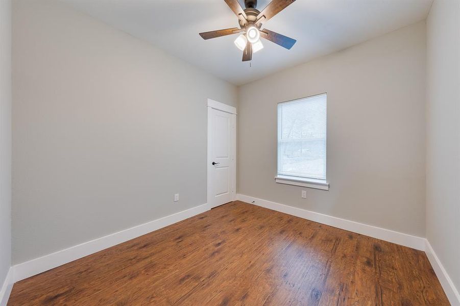 Third bedroom with a generous walk-in closet, providing plenty of storage and a cozy, functional living space.