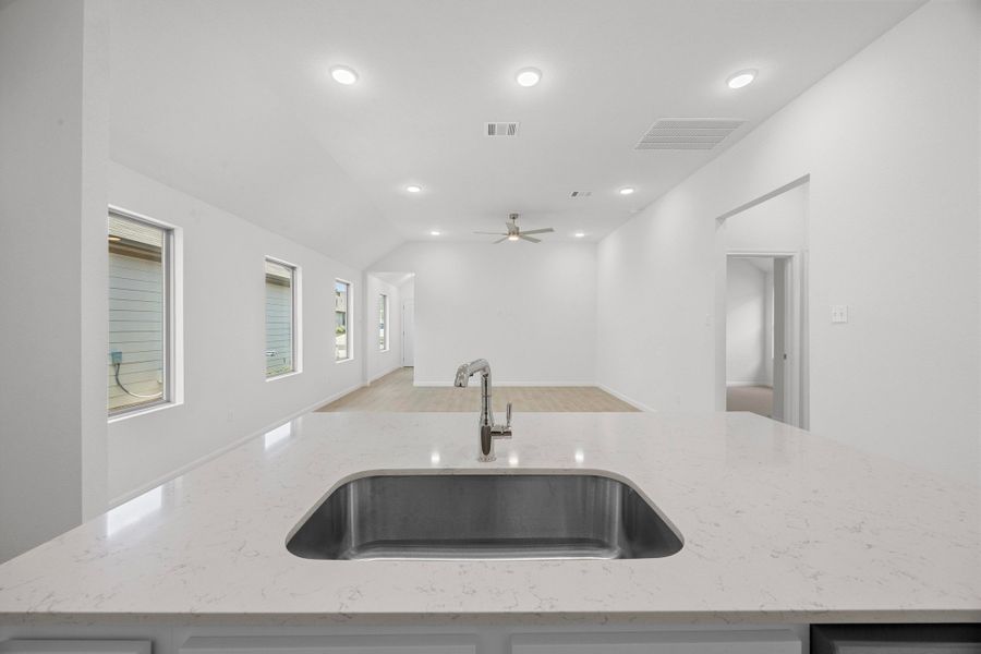 Kitchen in the Cypress home plan by Trophy Signature Homes - REPRESENTATIVE PHOTO