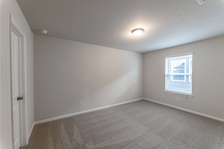 Spacious, unfurnished interior of a new home in The Woodlands at Medina Hills, Mico (Image 19).