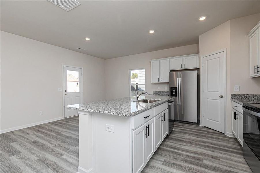 Furnished interior view inside a new home in Conners Landing at Mirror Lake, Villa Rica (Image 5).