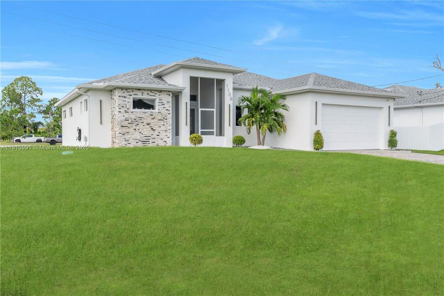 Front exterior of a new home in , Lehigh Acres, FL, highlighting curb appeal (Image 21).