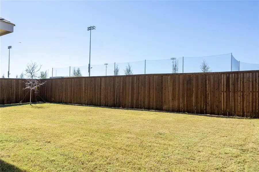 View of fenced backyard