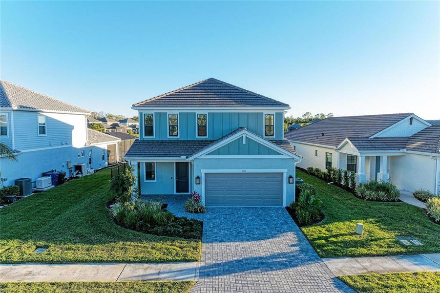 Front exterior of a new home in , Sarasota, FL, highlighting curb appeal (Image 24).