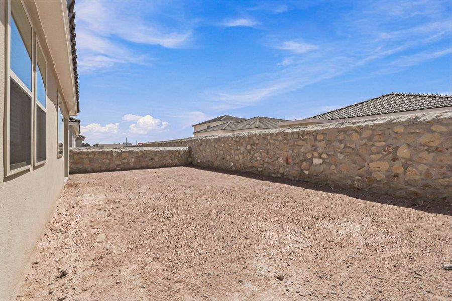 Exterior details and patio area of a home in Paseos Del Este, El Paso (Image 33).