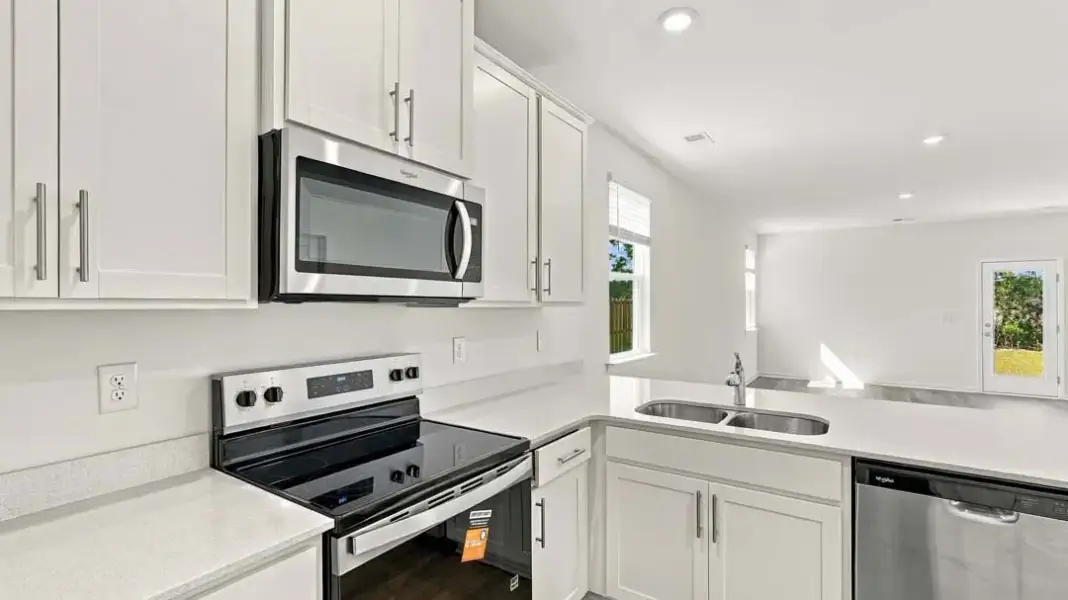 Furnished interior view inside a new home in The Lakes at North Glynn, Brunswick (Image 8).