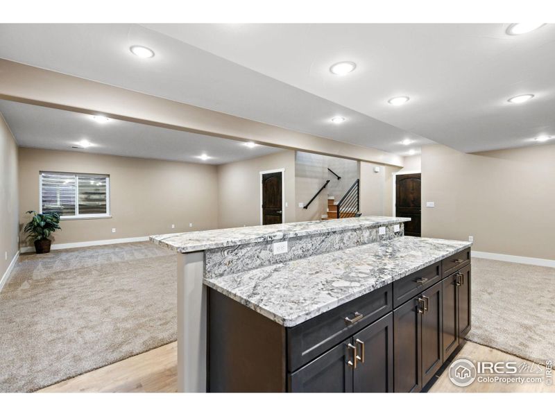 Granit counters, custom cabinets with soft close in the wet bar