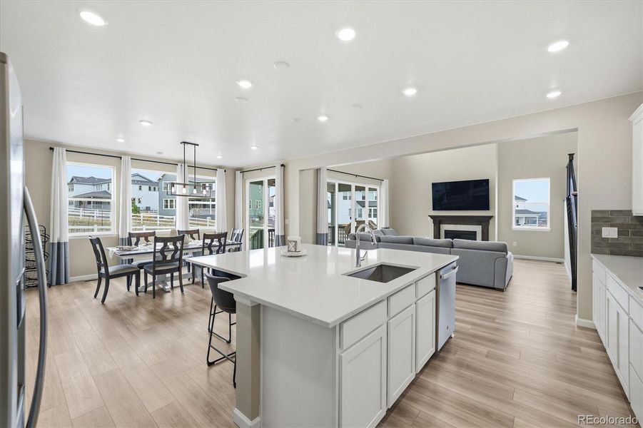 Luxury vinyl flooring throughout the main level of the property.