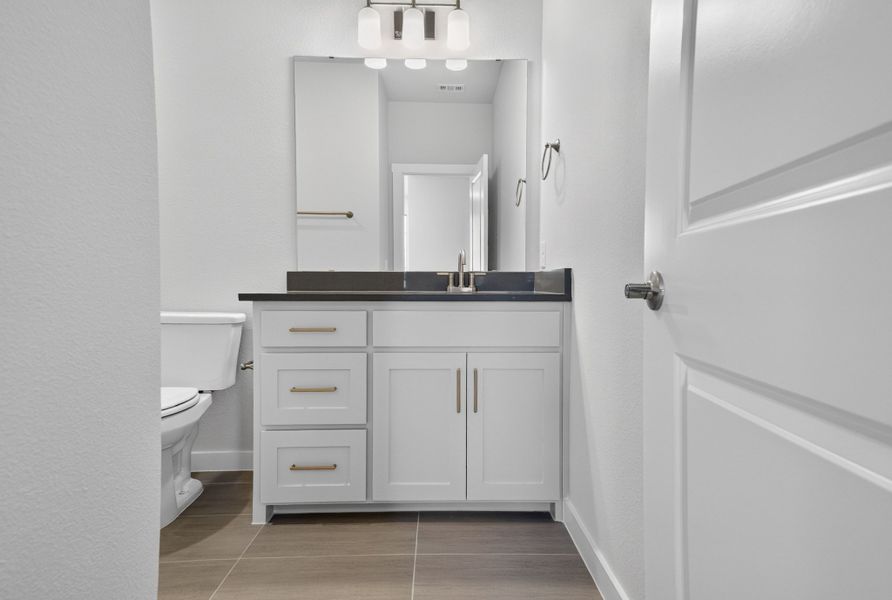 Furnished interior view inside a new home in The Tribute, The Colony (Image 32).