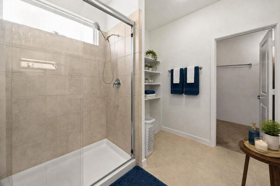 The walk-in shower adds a streamlined feature to the primary bathroom. Its clean tile finish and nearby vanity area create a practical, modern ensuite setup. Virtually staged. The walk-in shower adds a streamlined feature to the primary bathroom. Its clean tile finish and nearby vanity area create a practical, modern ensuite setup. Virtually staged.