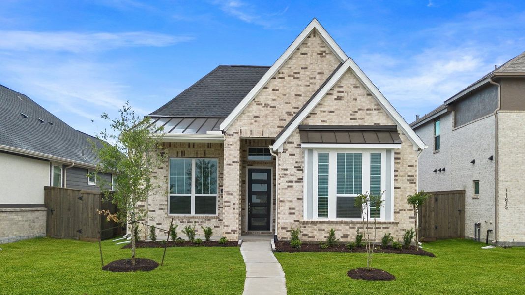 Front exterior of a new home in Riceland, Mont Belvieu, TX, highlighting curb appeal (Image 22). Front exterior of a new home in Riceland, Mont Belvieu, TX, highlighting curb appeal (Image 22).