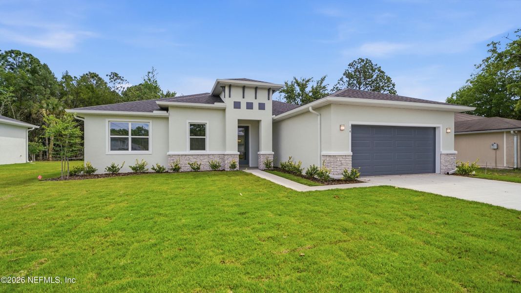 Front exterior of a new home in , Palm Coast, FL, highlighting curb appeal (Image 26).