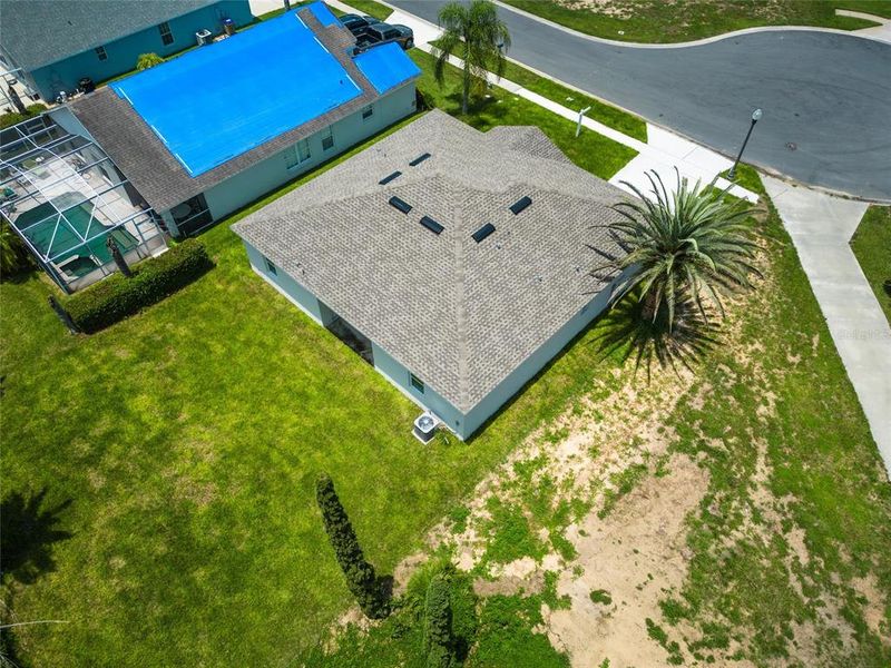Front exterior of a new home in , Kissimmee, FL, highlighting curb appeal (Image 32).