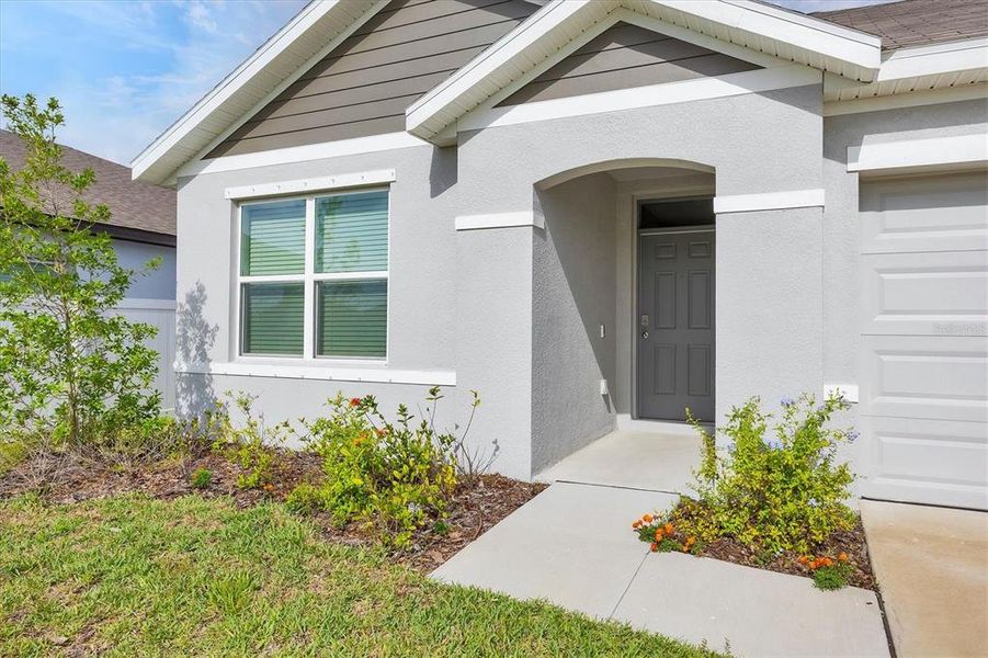 Front exterior of a new home in Glen Creek, Bradenton, FL, highlighting curb appeal (Image 20).
