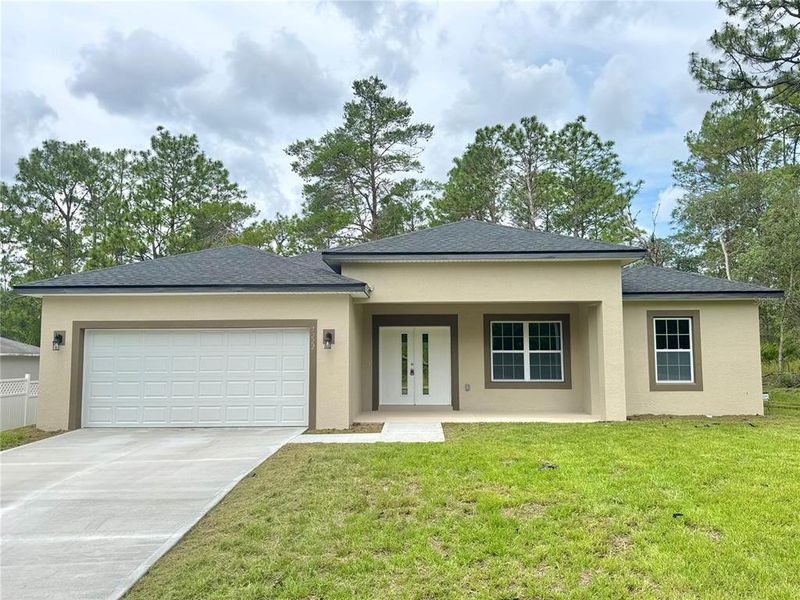 Front exterior of a new home in , Citrus Springs, FL, highlighting curb appeal (Image 18).