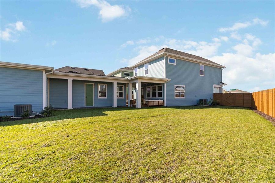 Exterior details and patio area of a home in Weslyn Park at Sunbridge (Craft Homes), St. Cloud (Image 26).