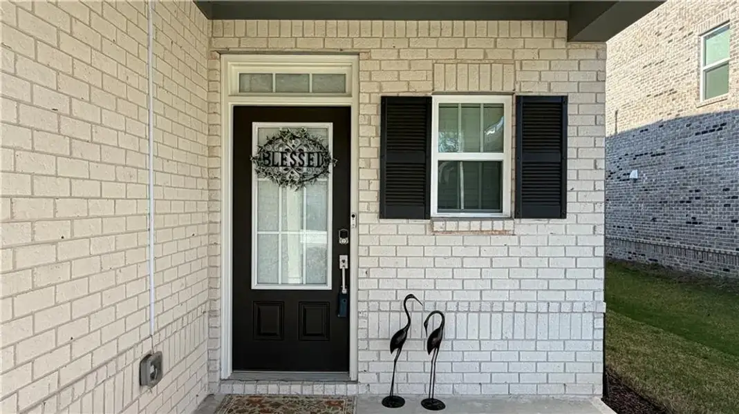 Exterior details and patio area of a home in Graystone Village, Grayson (Image 25).