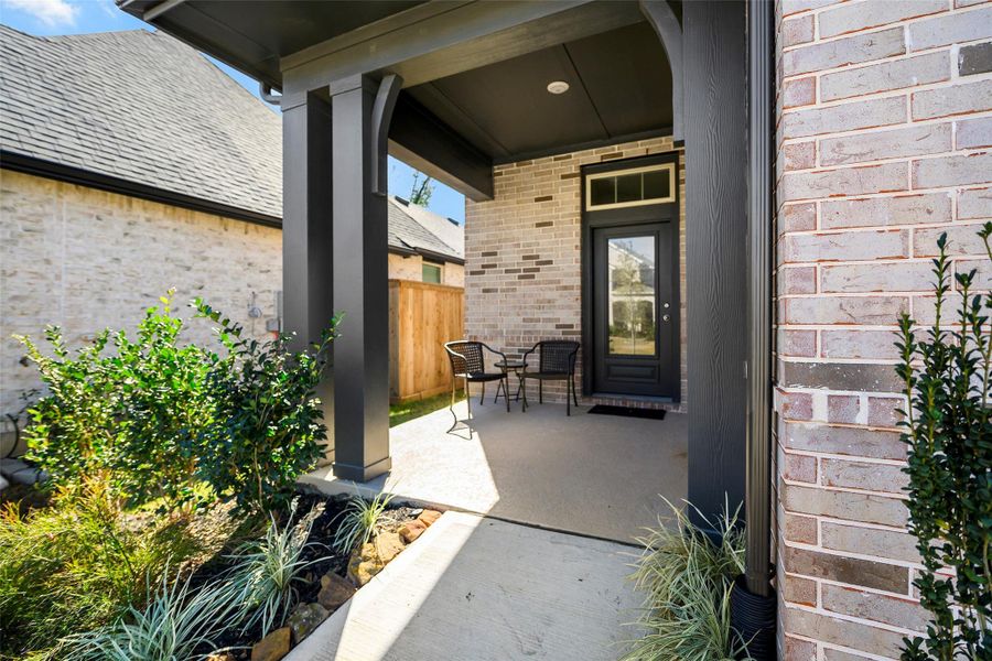 Exterior details and patio area of a home in The Highlands - Grove Collection, Porter (Image 22).