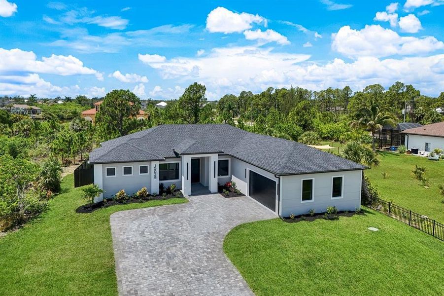 Front exterior of a new home in , Port Charlotte, FL, highlighting curb appeal (Image 1). Front exterior of a new home in , Port Charlotte, FL, highlighting curb appeal (Image 1).