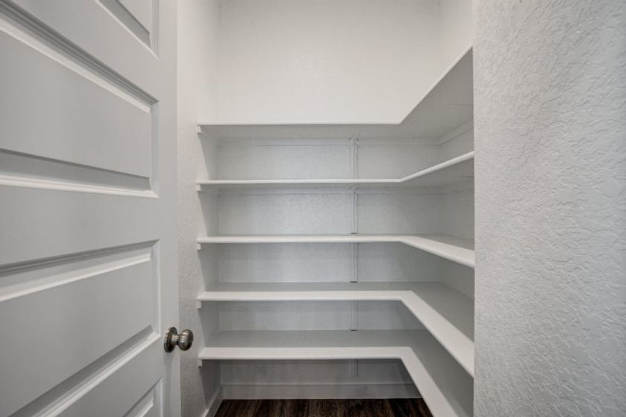 A white shelf with white doors. A white shelf with white doors.
