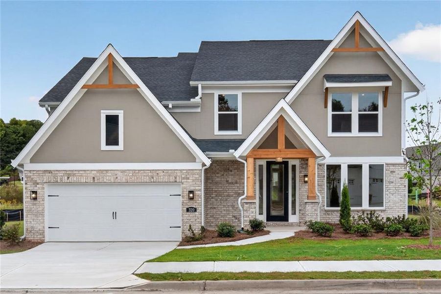 Front exterior of a new home in Hidden Fields, Hoschton, GA, highlighting curb appeal (Image 21). Front exterior of a new home in Hidden Fields, Hoschton, GA, highlighting curb appeal (Image 21).