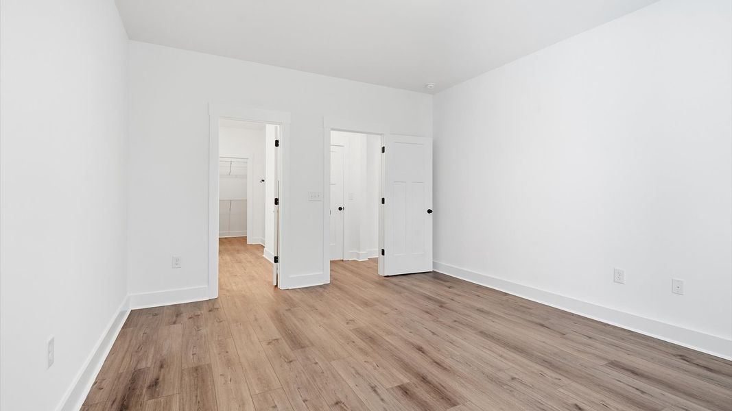 Eye-catching details and elegant finishes in the vibrant primary suite of this select home near Lake Hartwell Eye-catching details and elegant finishes in the vibrant primary suite of this select home near Lake Hartwell