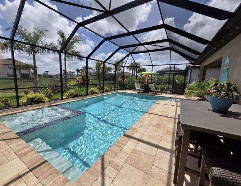 Exterior details and patio area of a home in , Estero (Image 27).