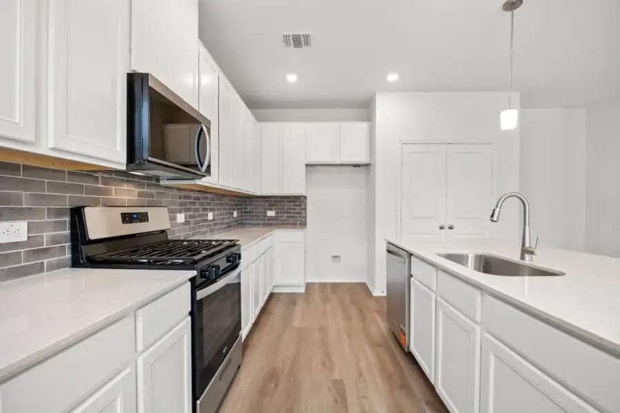 Furnished interior view inside a new home in River Bluff, Leander (Image 5).