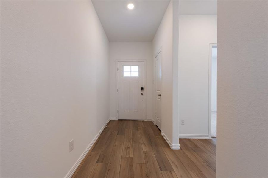 Entryway featuring wood-type flooring