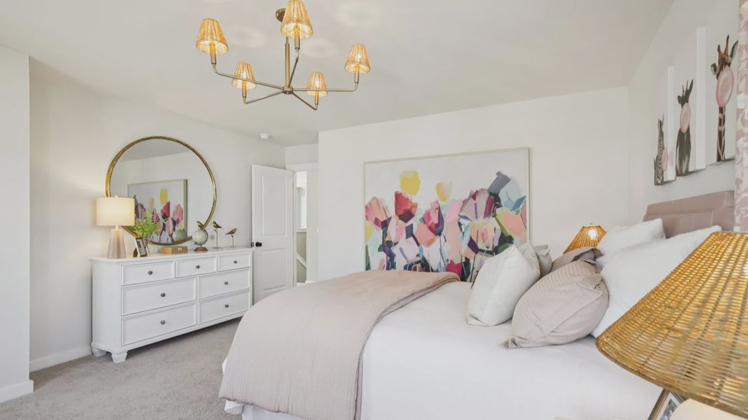 Bedroom with carpet and windows