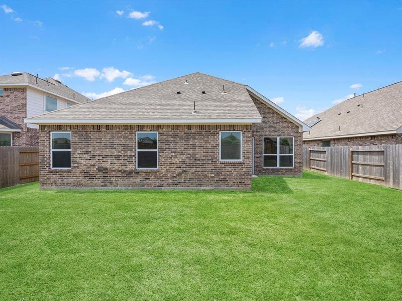 A house with a grass yard. A house with a grass yard.