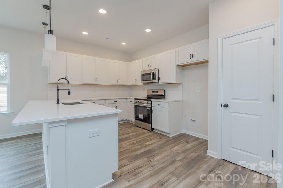 Furnished interior view inside a new home in Country Club Village, Salisbury (Image 4).