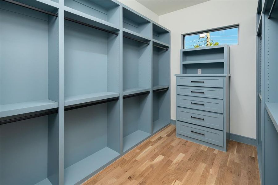 Spacious closet with light wood-type flooring