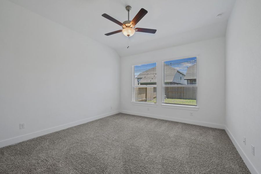 Representative unfurnished interior of a home built from the Sage by Chesmar Homes in Sunterra, Katy (Image 7).