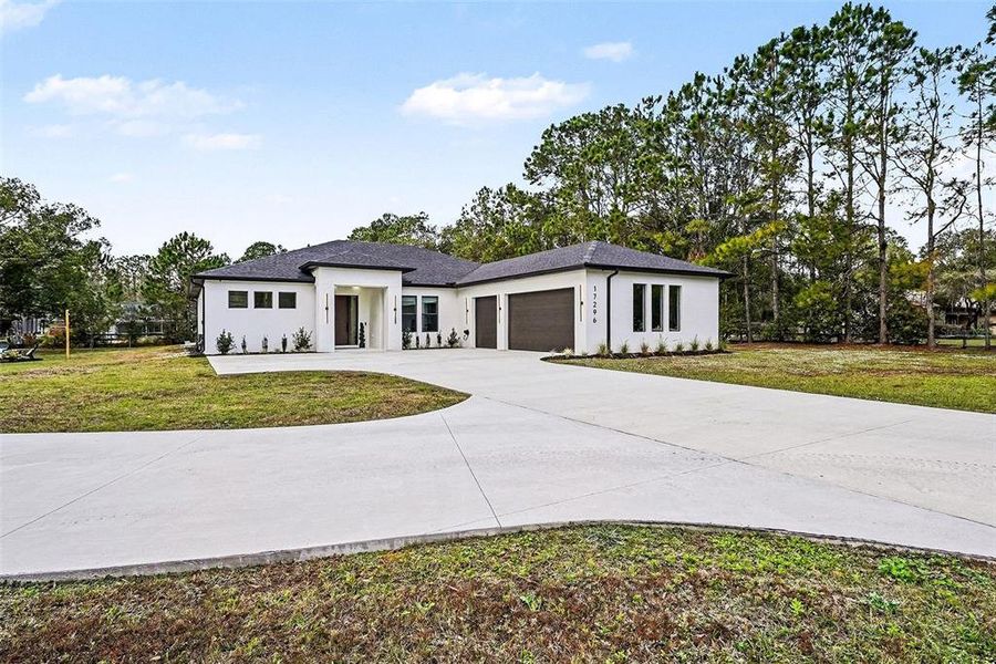 Front exterior of a new home in , Lutz, FL, highlighting curb appeal (Image 28).