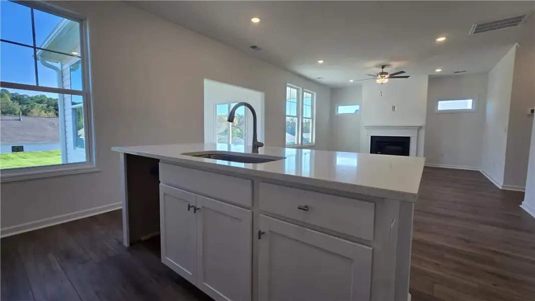 An open-concept design connects the central kitche